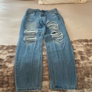 Woman’s ripped jeans